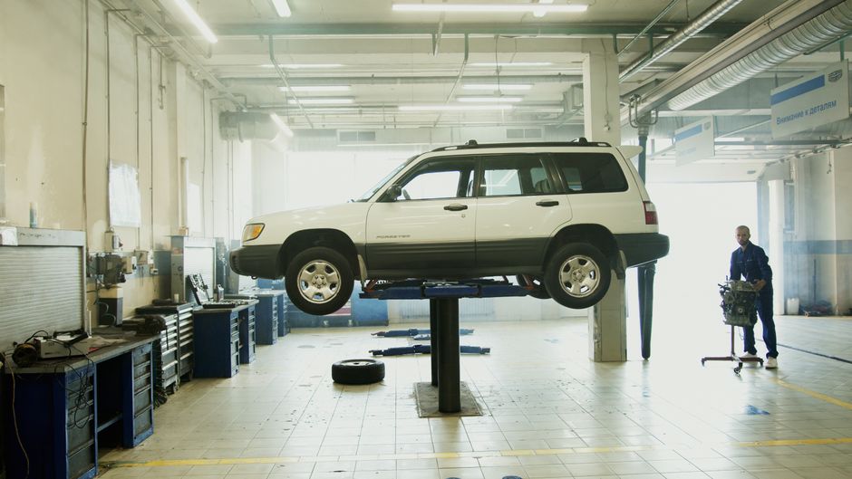 Wide view of the Ironwood Auto Repair garage with a car on the lift