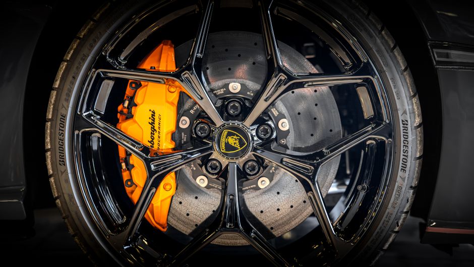 Close-up of a brake rotor and caliper during a brake job